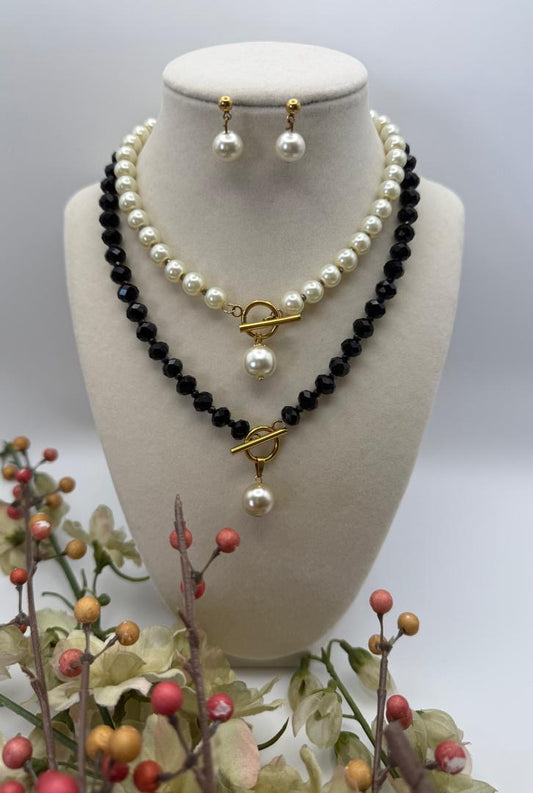 Black crystals necklace with T -luck and white pearl pendant